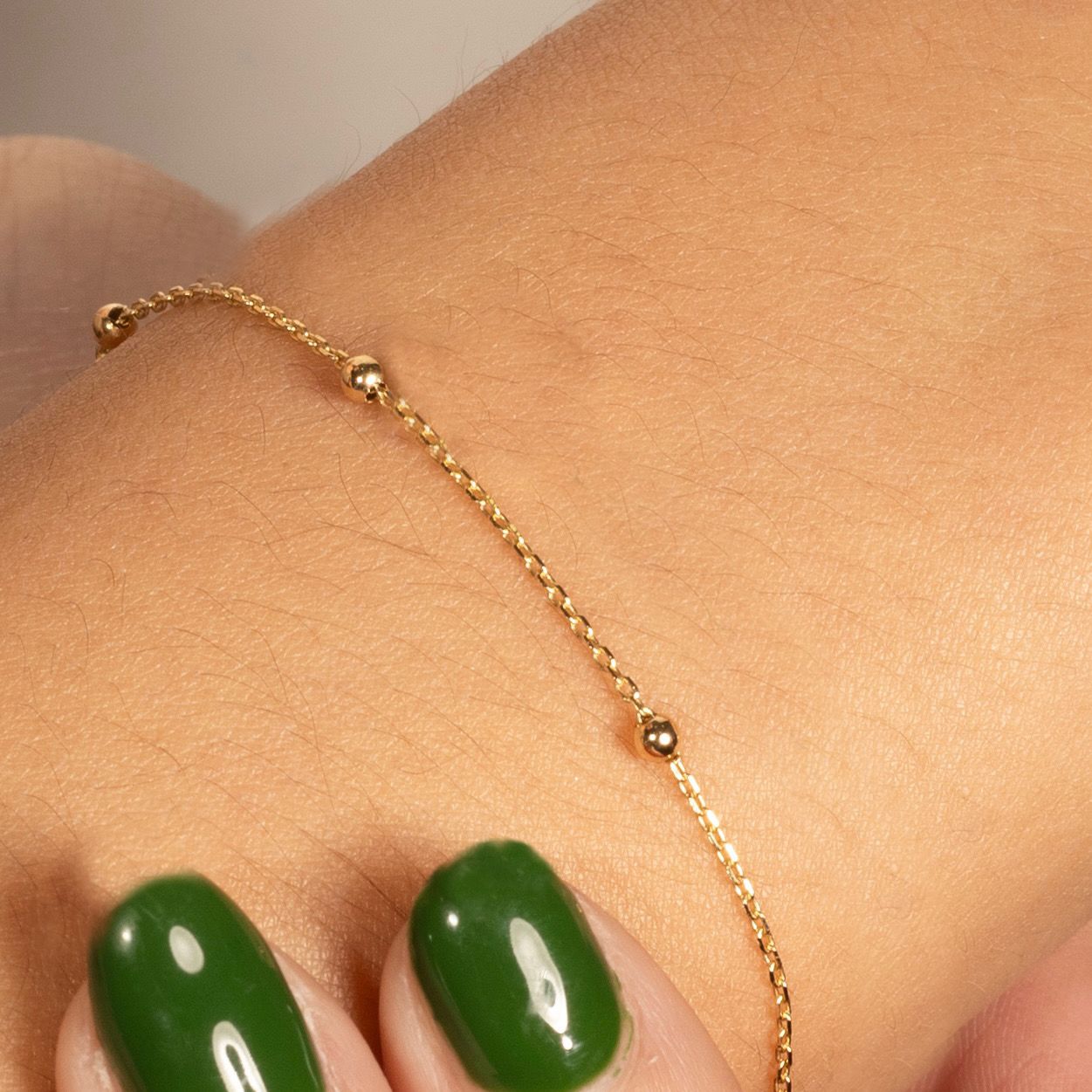 Pulsera de  Oro 14K con Bolitas Lisas